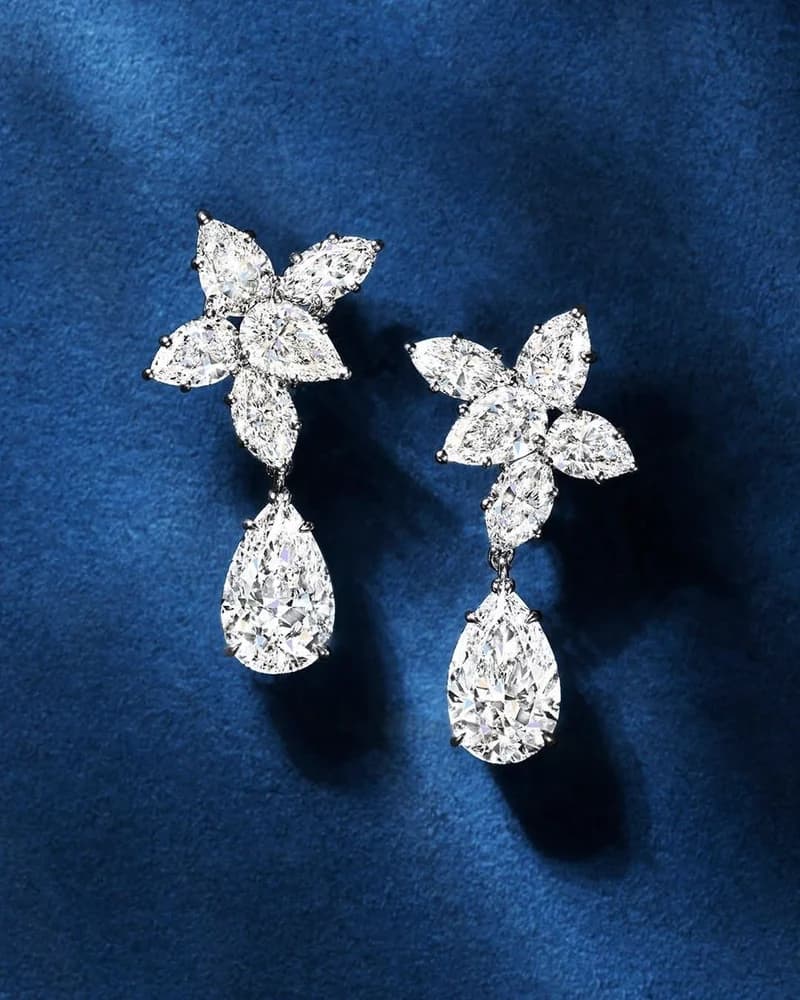 A pair of marquise-flower diamond earrings with large pear-cut drops.