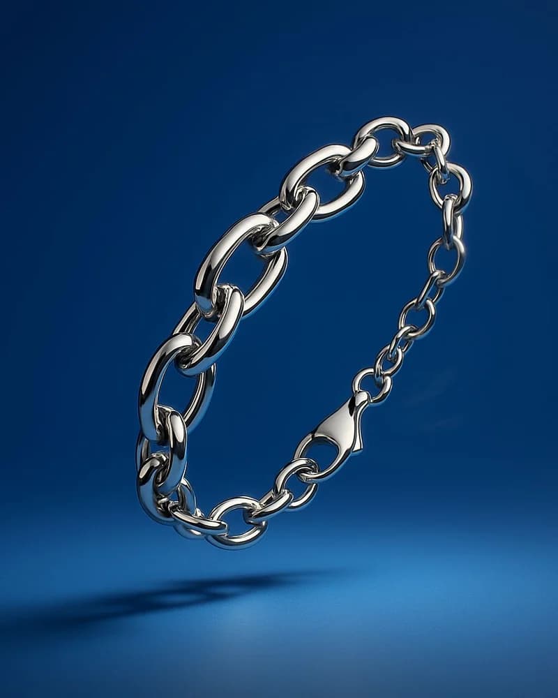 A white gold oval-link chain bracelet with a lobster clasp.